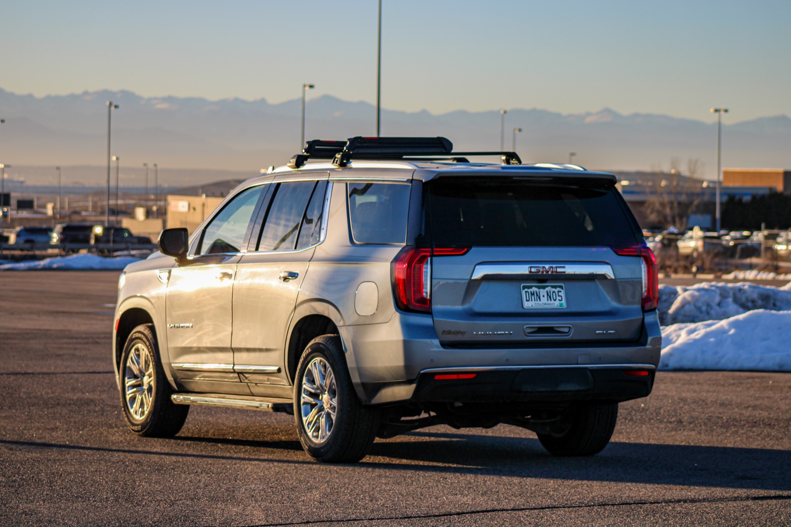 AWD SUV climbing the snowy I-70 corridor toward a Colorado ski resort