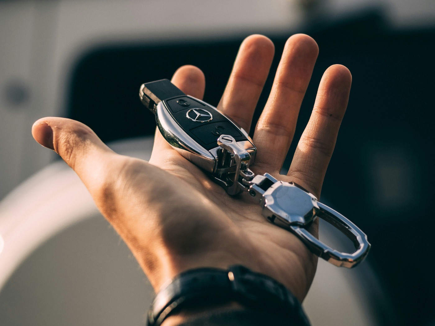 Mercedes-Benz key handed over at a Portland rental car delivery